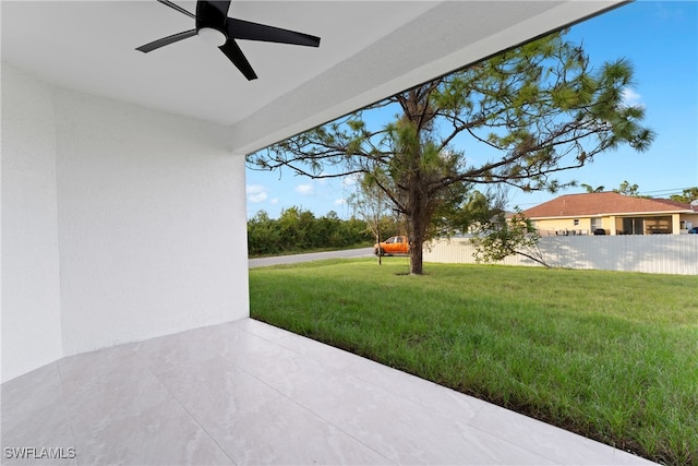 exterior space featuring ceiling fan