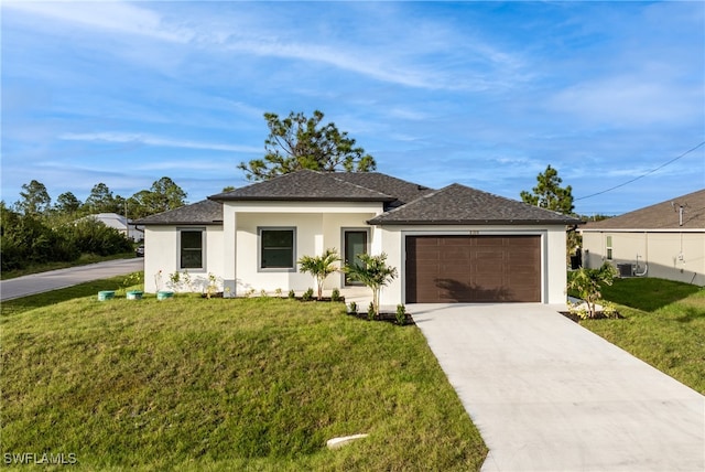 view of front of home with a garage and a front yard