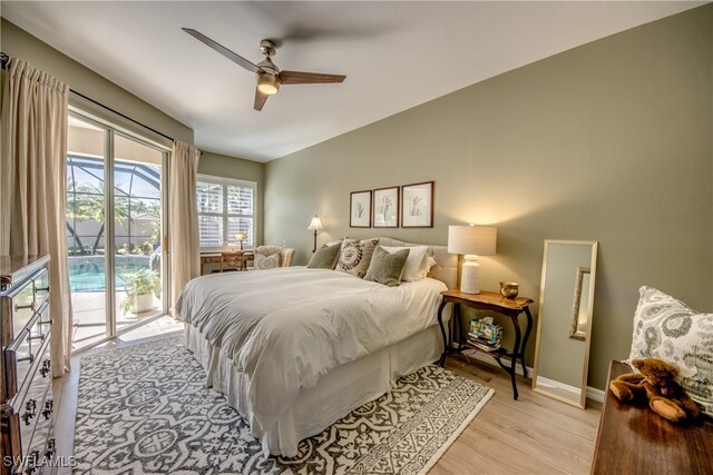 bedroom featuring access to outside, ceiling fan, and light wood-type flooring