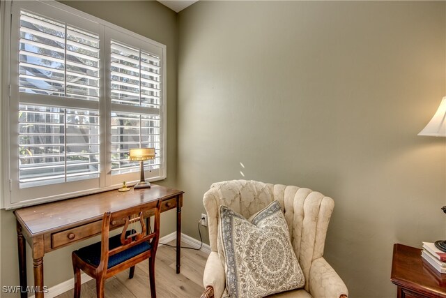 living area featuring plenty of natural light and light wood-type flooring