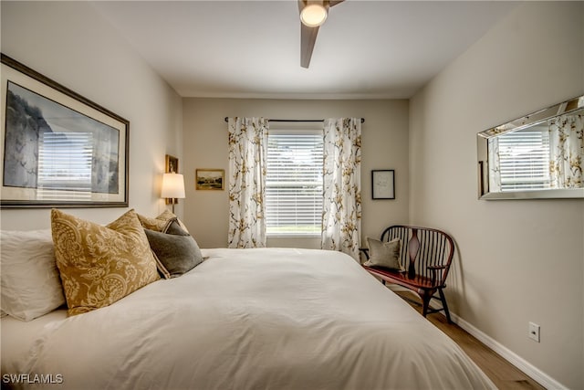 bedroom featuring hardwood / wood-style floors and ceiling fan