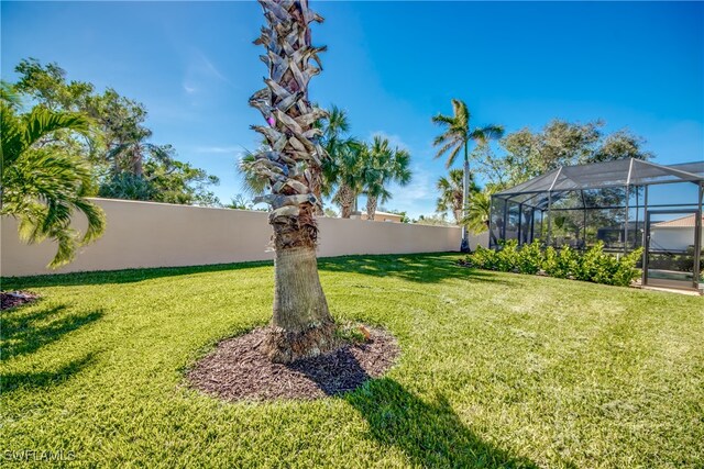 view of yard with a lanai