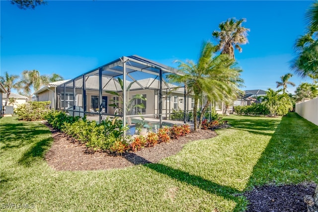 view of yard featuring glass enclosure