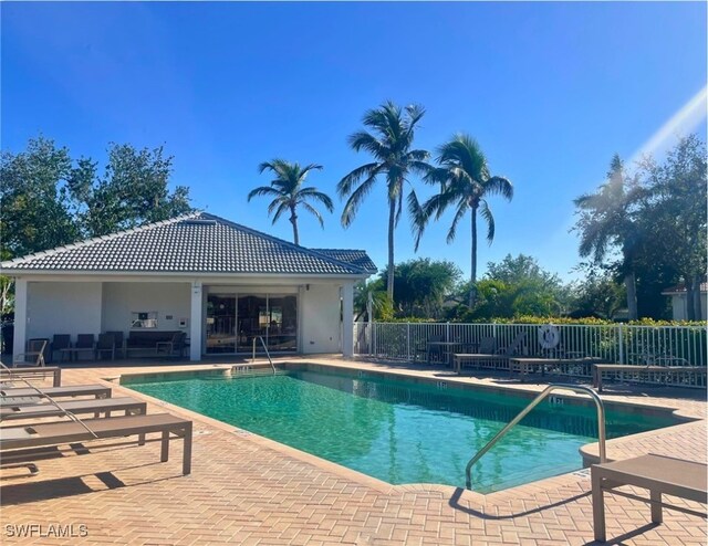 view of swimming pool featuring outdoor lounge area and a patio