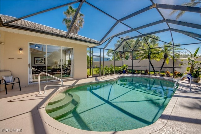 view of pool with a fenced in pool, a lanai, and a patio