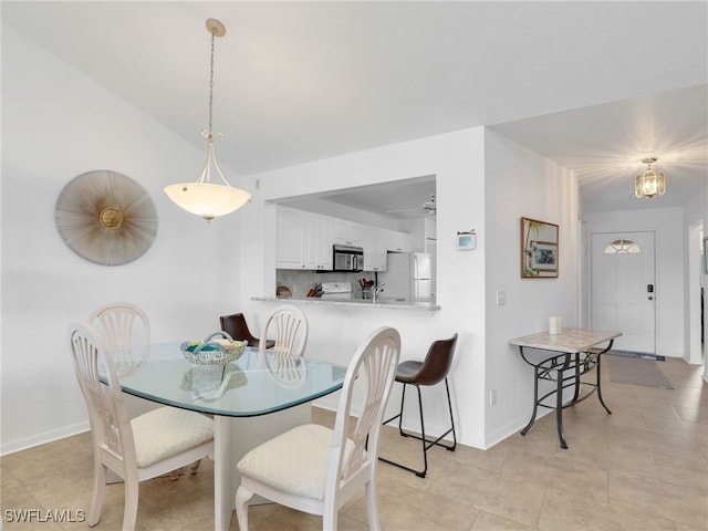 dining area with light tile patterned floors