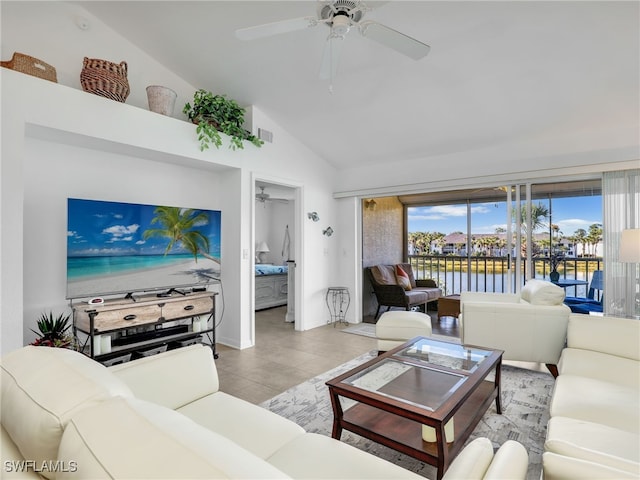 living room featuring ceiling fan, a water view, and high vaulted ceiling