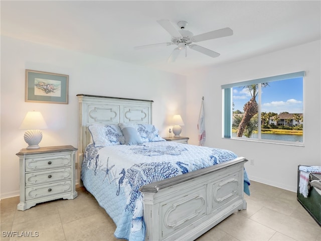 tiled bedroom featuring ceiling fan