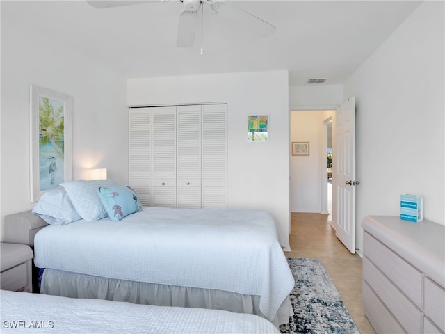 bedroom featuring a closet and ceiling fan