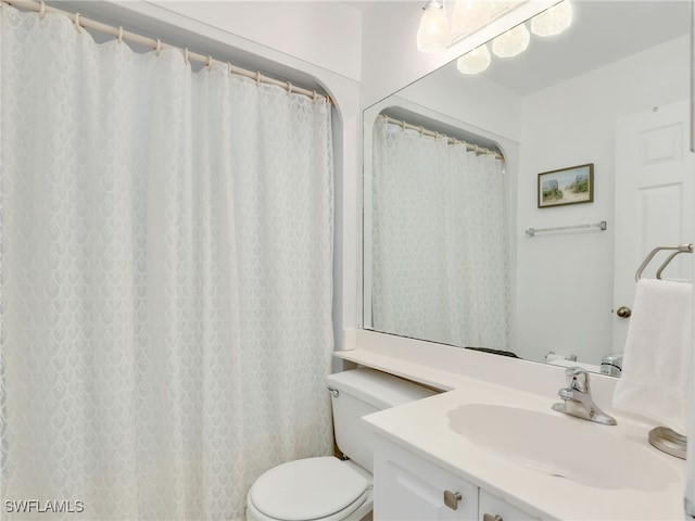 bathroom featuring vanity and toilet