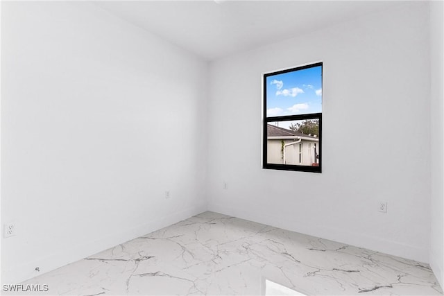 7029 Palpano Cir, Labelle, FL 33935 - spare room featuring marble finish floors and baseboards