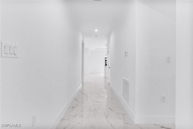 7029 Palpano Cir, Labelle, FL 33935 - hallway with baseboards, light marble finish flooring, and recessed lighting