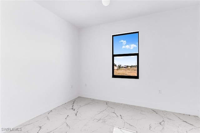 7029 Palpano Cir, Labelle, FL 33935 - unfurnished room featuring light marble finish flooring and baseboards
