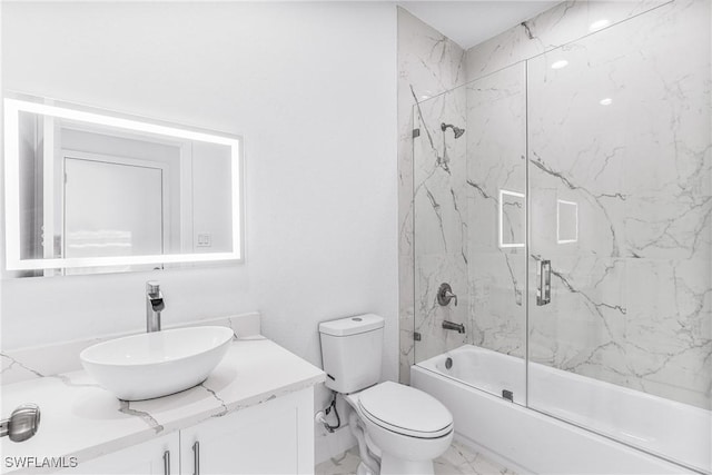 7029 Palpano Cir, Labelle, FL 33935 - bathroom featuring vanity, enclosed tub / shower combo, marble finish floors, and toilet