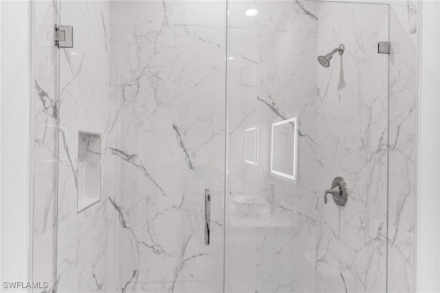 room details featuring a shower with shower door