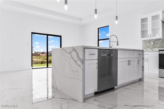 7029 Palpano Cir, Labelle, FL 33935 - kitchen featuring appliances with stainless steel finishes, light marble finish flooring, plenty of natural light, and light stone counters