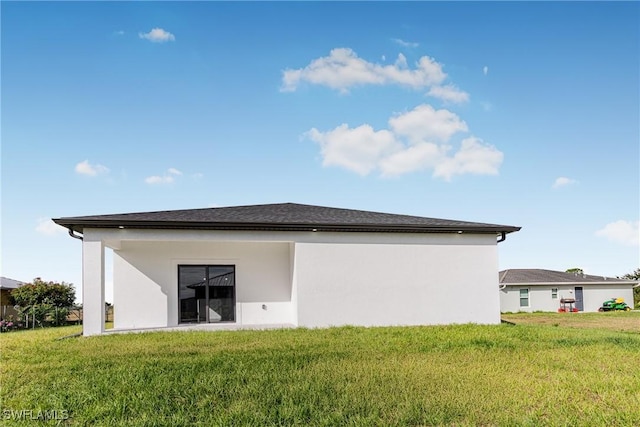 7029 Palpano Cir, Labelle, FL 33935 - rear view of property with a lawn and stucco siding