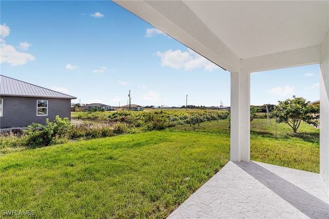 view of yard with a patio area and a rural view