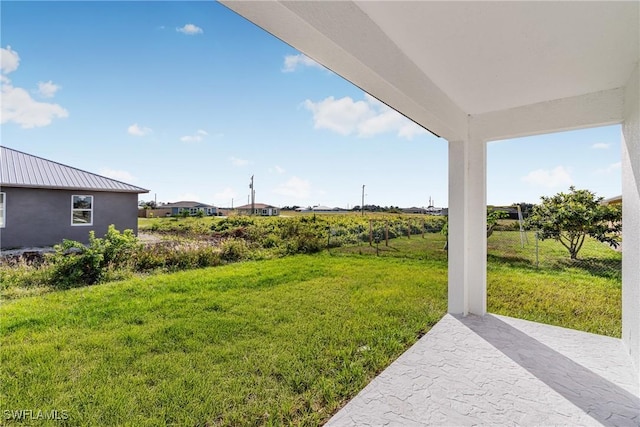 7029 Palpano Cir, Labelle, FL 33935 - view of grassy yard featuring a patio area