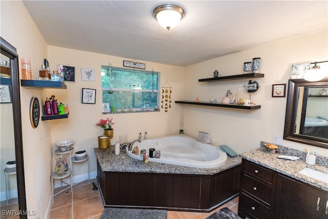 bathroom featuring tile patterned flooring, vanity, and a bathing tub