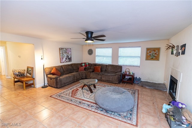 tiled living room with ceiling fan