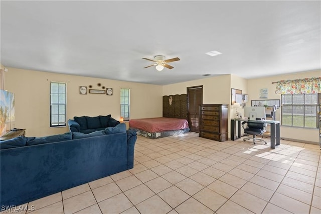 bedroom featuring ceiling fan and light tile patterned flooring