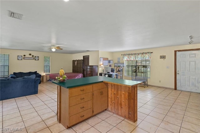 kitchen featuring ceiling fan and light tile patterned floors