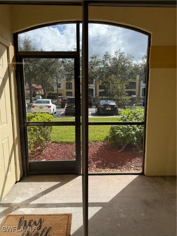 doorway to outside with concrete floors