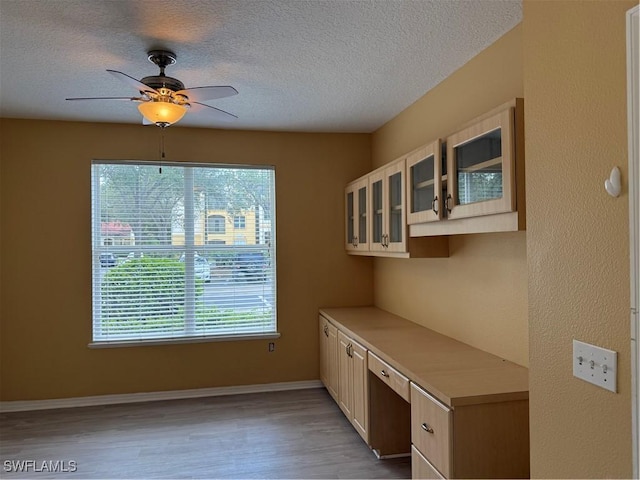 11510 Villa Grand Unit 407, Fort Myers, FL 33913 - unfurnished office featuring ceiling fan, light wood finished floors, a textured ceiling, and built in study area