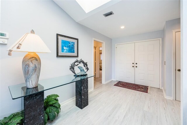 76 Cypress View Dr Unit E-76, Naples, FL 34113 - entrance foyer featuring wood finished floors, baseboards, a skylight, and recessed lighting