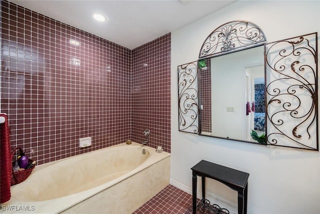 bathroom with tile patterned flooring and tiled shower / bath