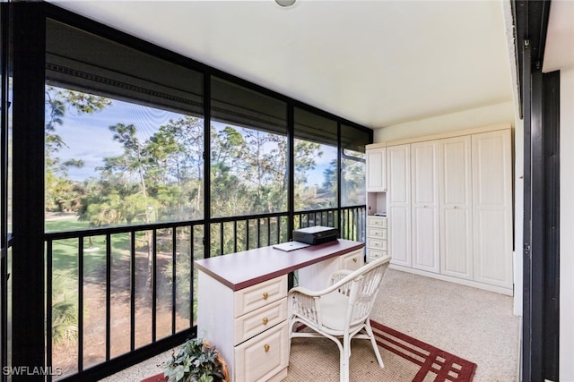 office area with floor to ceiling windows