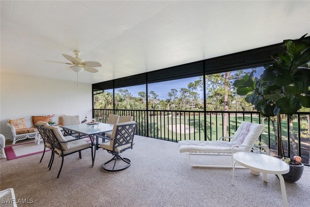 sunroom featuring ceiling fan