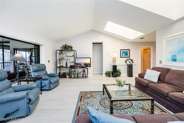 living room featuring light hardwood / wood-style flooring and lofted ceiling with skylight