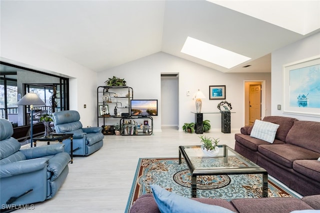 76 Cypress View Dr Unit E-76, Naples, FL 34113 - living room featuring a skylight, lofted ceiling, and wood finished floors