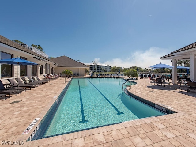 view of swimming pool with a patio