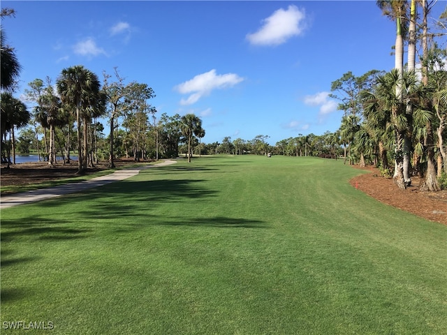 76 Cypress View Dr Unit E-76, Naples, FL 34113 - view of community with view of golf course and view of wooded area