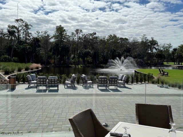 view of patio with a water view