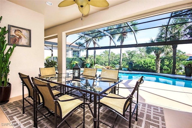 exterior space featuring a patio, ceiling fan, and a lanai