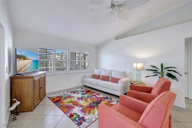 tiled living room with ceiling fan and lofted ceiling