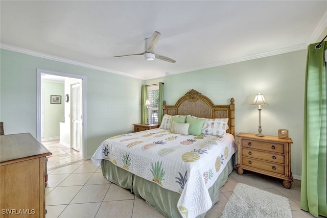 tiled bedroom with connected bathroom, ceiling fan, and ornamental molding