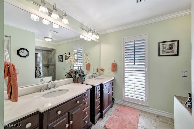 bathroom featuring a wealth of natural light, a shower with shower door, and ornamental molding