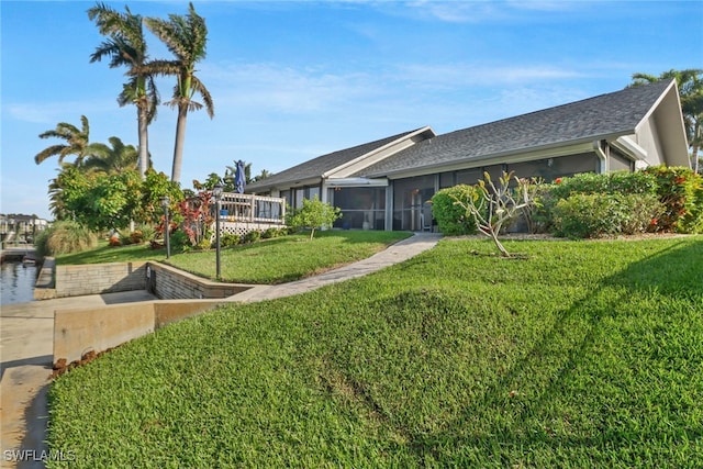 view of yard featuring a sunroom