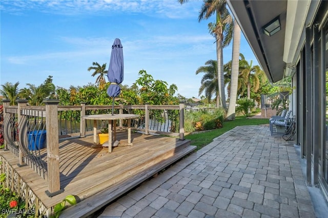 wooden deck with a patio