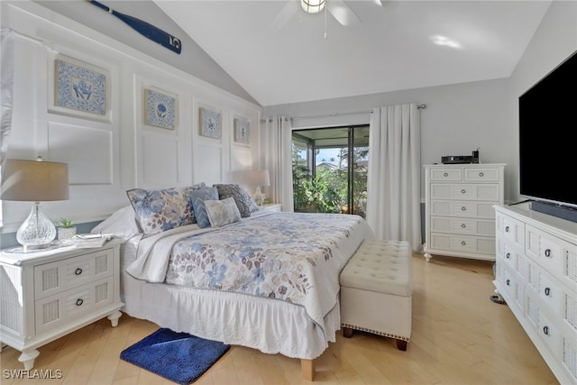 bedroom featuring access to exterior, light wood-type flooring, vaulted ceiling, and ceiling fan