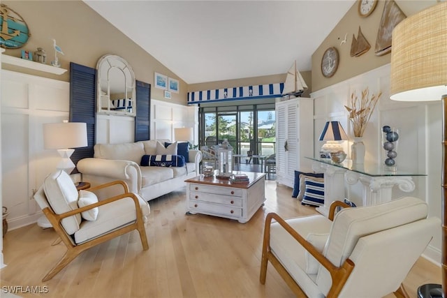 interior space featuring light hardwood / wood-style flooring and high vaulted ceiling