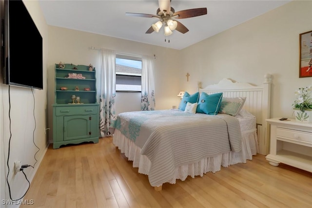 bedroom featuring ceiling fan and light hardwood / wood-style flooring