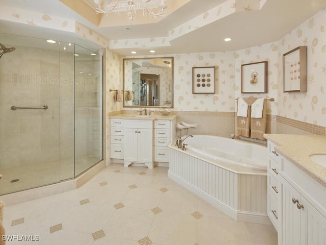 bathroom featuring tile patterned flooring, vanity, and independent shower and bath