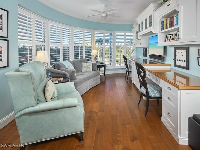 office space featuring crown molding, ceiling fan, and dark wood-type flooring