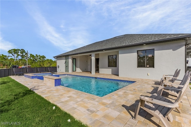 view of swimming pool featuring an in ground hot tub, ceiling fan, and a patio